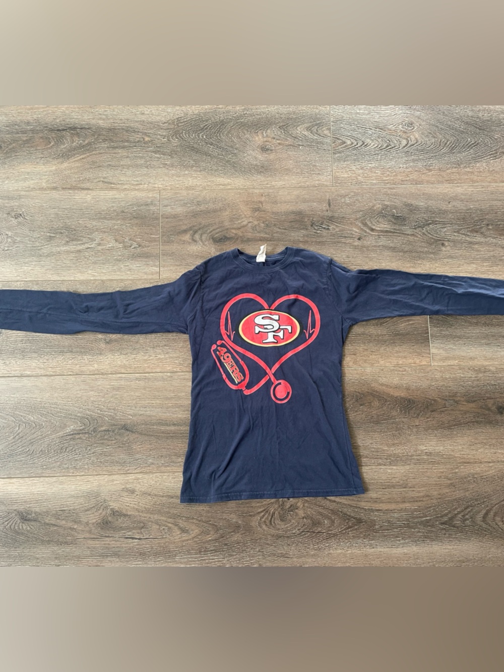 San Francisco 49ers Navy Long-Sleeve Heart Logo Tee with stethoscope